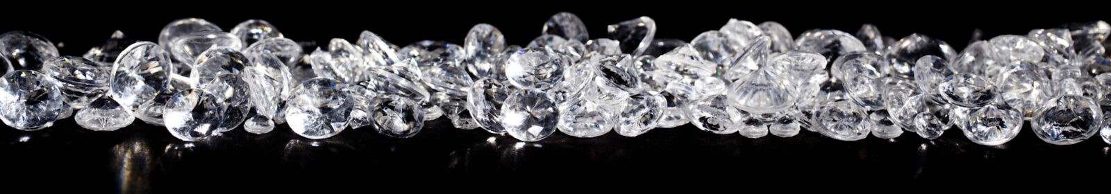 Diamonds on black backgroundPile of diamonds on a black background close up